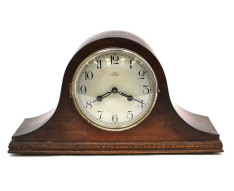 A late 1940s / early 1950s mantel clock by G &amp; F Evans Ltd of Coventry in oak, 8-day clock with key in working order.