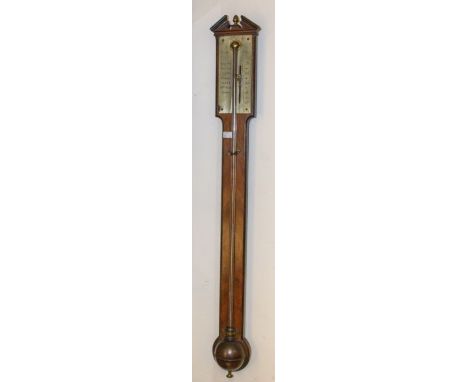 of London stick barometer the silvered face inscribed with makers name. A mahogany case brass rectangular face (was silvered)