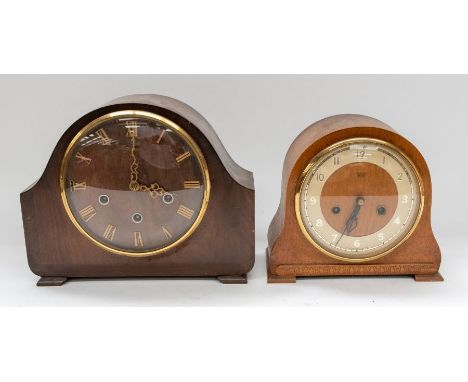 A 3-train mantel clock with wooden case with a 2-train mantel clock with wooden case.