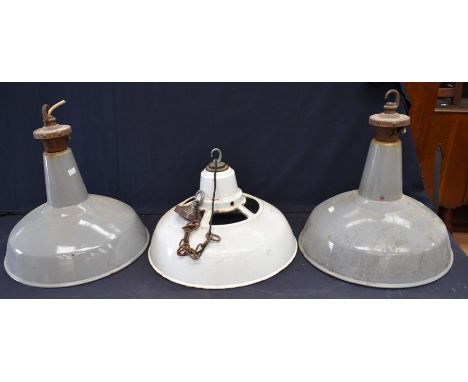 Three 1930s enameled, metal, industrial warehouse light shades.