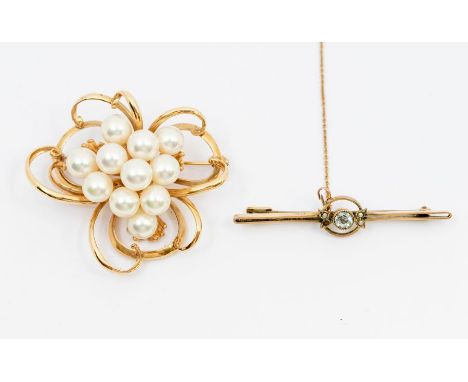 A cultured pearl and 14ct gold brooch, comprising a cluster of round cultured pearls within a wirework stylized flower surrou