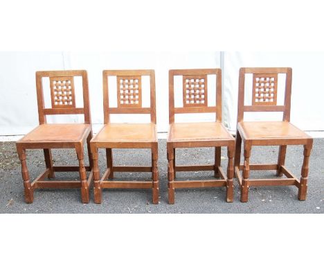 Robert 'Mouseman' Thompson - Four Oak lattice backed dining chairs, with leather seats, each with the signature carved 'Mouse