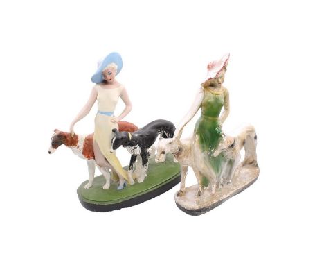 Two early 20th Century plaster figures of ladies with hunting dogs