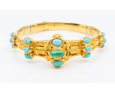 A Victorian turquoise set gold bangle, set to the top with oval cabochon turquoise stones, with engraved decoration, hinged s