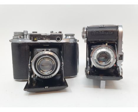 An Ensign Commando folding camera, and a Balda folding camera, with a leather outer case (2)Provenance: part of a vast single