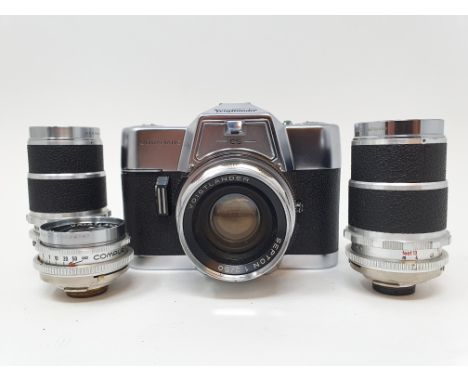 A Voigtlander Automatic CS camera, with leather outer case, three lenses, with various accessories, in leather carrying caseP