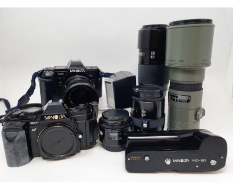 A Minolta 9000 camera, a Minolta 7000 camera, various lenses and accessories in a carrying caseProvenance: Part of a vast sin