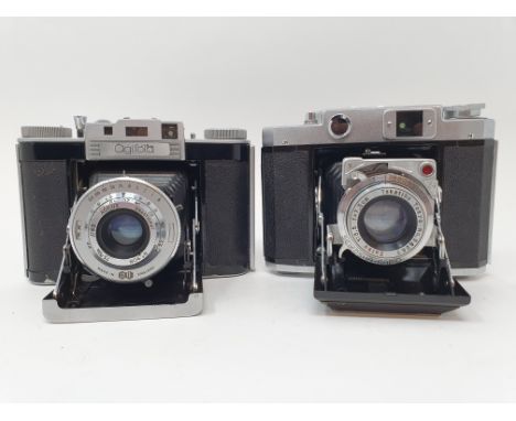 A Mamiya-6 folding camera, with leather outer case, and an Agiwx Agifold folding camera, with leather outer case (2)Provenanc