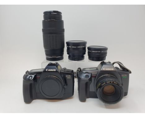 A Canon EOS 600 camera, a Canon EOS 650, three lenses, a flash and a Sacra leather camera boxProvenance: Part of a vast singl