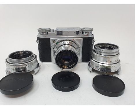 A Voitlander Brominent camera, with leather outer case, two lenses, various accessories, in fitted leather camera bagProvenan