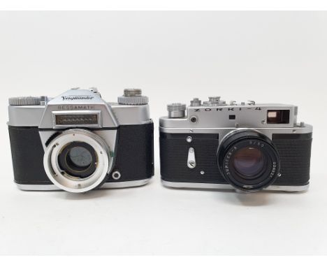 A Voigtlander Bessamatic camera and a Russian Zorki-4 camera, with leather outer caseProvenance: Part of a vast single owner 