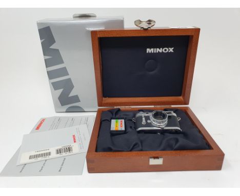 A Minox miniature Leica M3 60 501, in mahogany presentation case, with paperwork, boxedProvenance:  Part of a vast single own