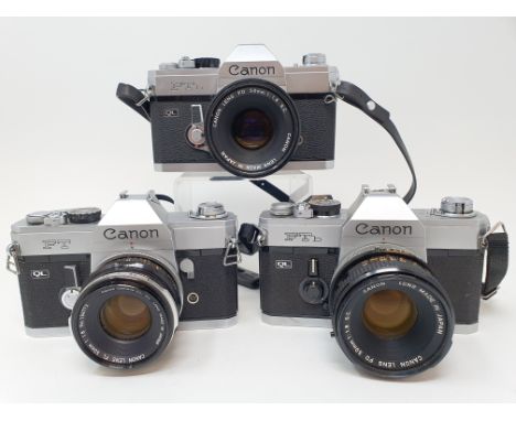 A Canon FTb camera, a Canon FTb camera and a Canon FT camera, in outer case, outer case very worn (3)Provenance: Part of a va