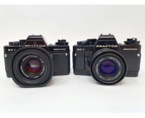 A Praktica BC 1 camera, with leather outer case, and a Praktica BC 1 camera, with leather outer case (2)Provenance: Part of a
