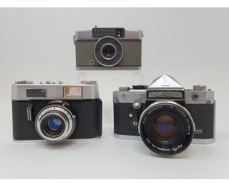 A Voigtlander Vitoret D camera, a Petri V Flex camera, and an Olympus-Pen camera (3)Provenance:  Part of a vast single owner 