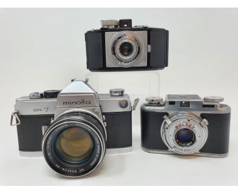 A Minolta SR-7 camera, with leather outer case, a Bolsey camera, and an Agfa bakelite camera (3)Provenance: Part of a vast si