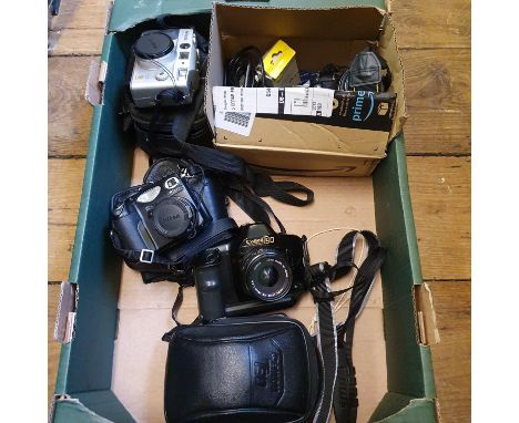 A Nikon D50 digital camera, a Canon T90 camera, a Nikon Coolpix 5000 digital camera, a Lumix camera, three outer cases and ot