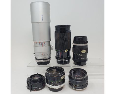 A Tamron camera lens, five other lenses, and a Minolta camera box (qty)Provenance:  Part of a vast single owner collection of