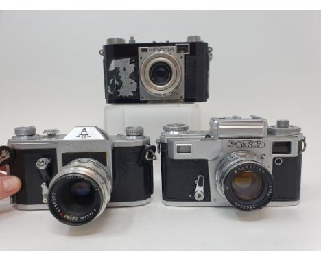 A Neoca camera, with leather outer case, a Pentacon ZI camera and a Russian camera, with leather outer case (3)Provenance: Pa