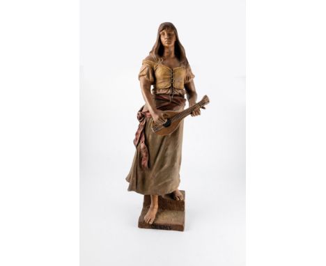 ''Mignon'' Friedrich Goldscheider, Wien, um 1897 Stehendes Bauernmädchen mit Mandoline auf Rechtecksockel. Terrakotta, farbig