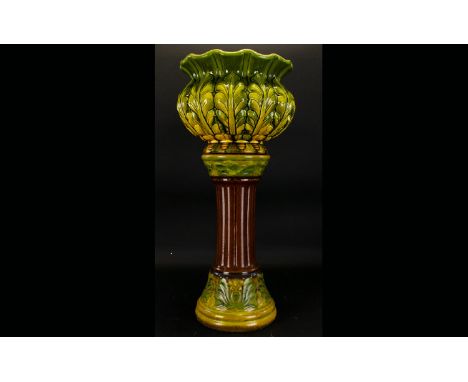 A Bretby Majolica Jardiniere, Art Nouveau foliate design jardiniere in green and chartreuse glaze, impressed mark to base ,11