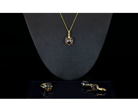 A Contemporary Silver Vermeil And Smoky Topaz Jewellery Suite Comprising pendant necklace, wired earrings, and statement ring