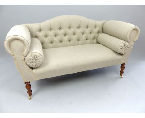 Arch back, window seat, scroll arms, roll cushions, buttonback, turned legs and brass castors, 135cm w