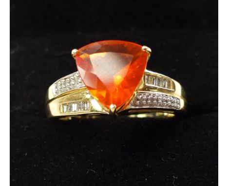 Fire opal and diamond dress ring, opal trillion cut, set within a 14ct yellow gold band 