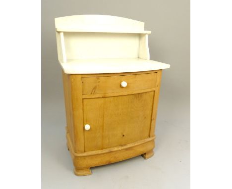 19th / 20th C wash stand, white marble top and splashback, bow front drawer and cupboard with ceramic handles, ogee feet, 71c