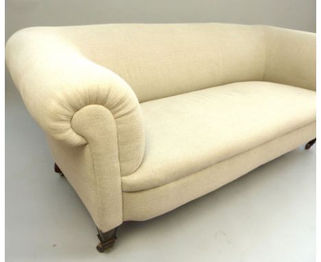 Chesterfield style upholstered sofa, covered in oatmeal coloured fabric, raised on short square tapering legs ending in casto