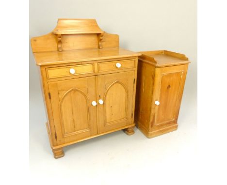 Pine small chiffonier, scroll back with shelf over two drawers and two doors with Gothic arch panels, ceramic handles, steppe