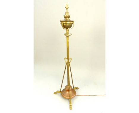 Late Victorian copper and brass standard lamp, converted from an oil lamp, the reservoir adjustable in height, above a weight