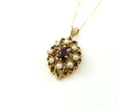 Edwardian style split seed pearl and garnet pendant, suspended on 9ct yellow gold chain 