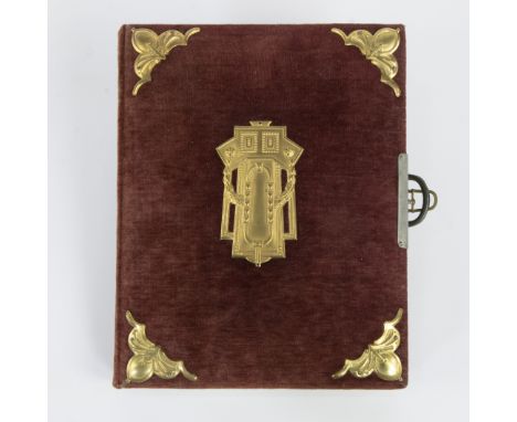 Beautifully designed 19th century photo book with a burgundy velvet cover, richly decorated with gilded metal corners and a c