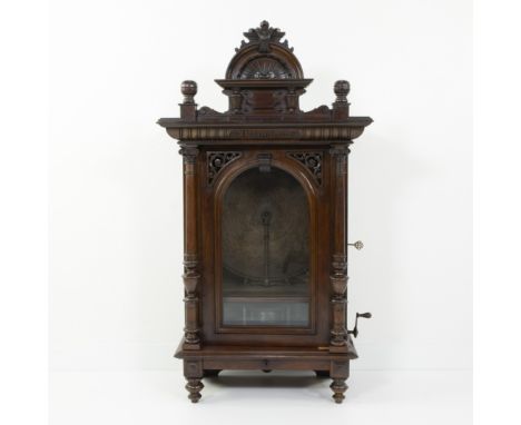 Antique Polyphon music box, late 19th century, in richly carved dark oak cabinet in neo-Renaissance styleAntieke Polyphon muz