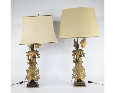 Pair of table lamps  in the shape of gilded metal figures in traditional Thai court dress, each holding a lotus leaf attribut