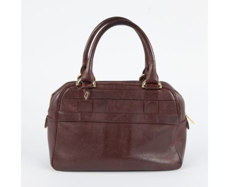 Small compact leather ladies handbag 'Parole' by Delvaux with short handles in burgundy redKleine compacte leren dameshandtas