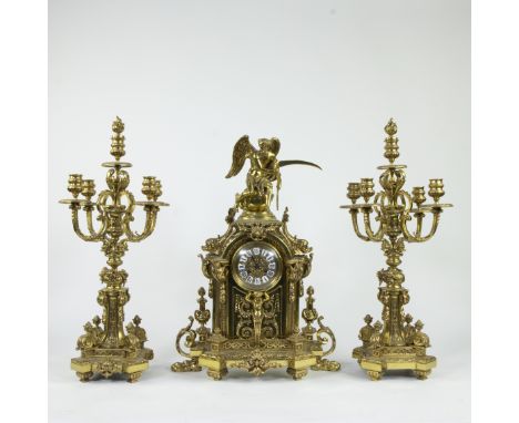 Gilt bronze mantelpiece set in Louis XV style, consisting of a pendulum with winged figure of Chronos and two five-armed cand