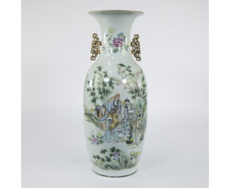 Chinese famille rose baluster vase decorated with a lively garden scene with scholars in a bamboo forest-like landscape, surr