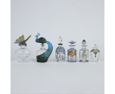 Collection of 6 perfume bottles, 4 enamelled and 2 decorated with peacock and butterfly, including Daum, Royales de Champagne