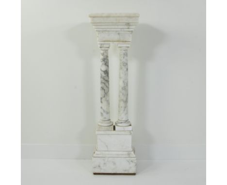 Pedestal in white marble with grey veins in neoclassical style, consisting of four columns on a square base and square capita