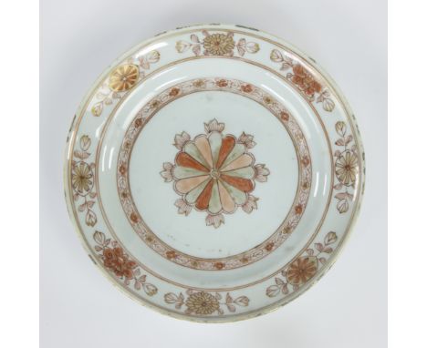 Chinese porcelain deep plate, decorated in iron red and gold, central lotus motif with 16 leaves, rim with floral motifs, mar