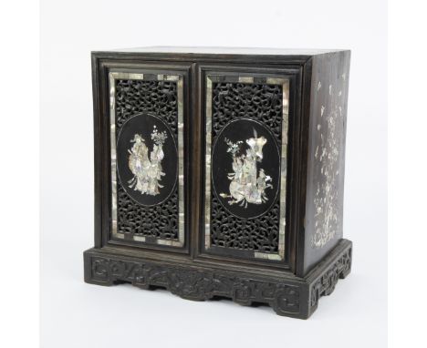 Chinese cabinet with openwork door panels and richly decorated with beautiful mother-of-pearl inlay, Late Qing Dynasty or ear