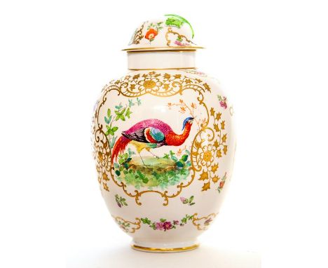 An English porcelain vase and cover. Decorated with an exotic bird on one side and floral sprays on the reverse within gilt s