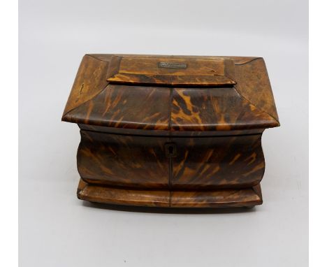 A early Victorian bombé form tortoiseshell tea caddy, engraved cartouche to top, the lid enclosing fitted two sectioned inter