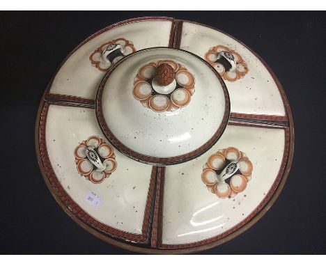 A creamware five piece entre set in circular wooden tray, with a central pedestal foot circular dish with cover terminating i