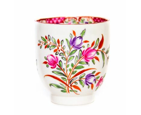 A Worcester polychrome coffee cup painted with floral sprays. Circa 1780.Size 6cm. diameter, 7cm. high.Condition; Scuffs to f