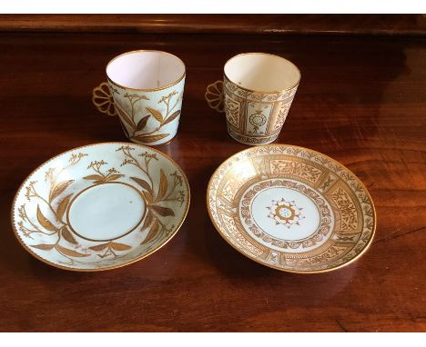 Two Royal Crown Derby coffee cans and saucers. Turquoise ground with half fan handles with raised gilding.Date early 20th cen