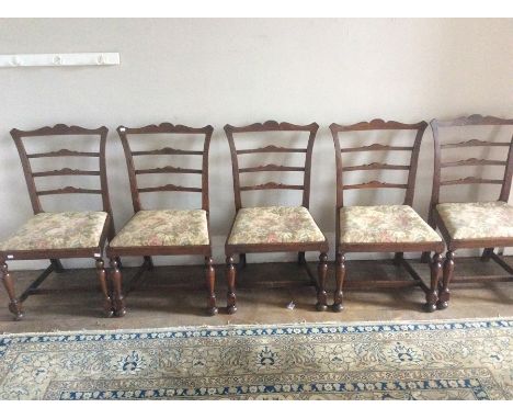 A set of six Chippendale oak ladder back chairs, early 20th Century (6)