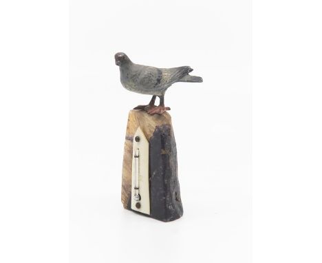 A thermometer mounted on a piece of polished Blue John rock, with a small pigeon figure standing to top, temperature in Fahre